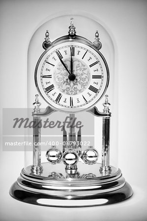 Classic clock almost at twelve black and white