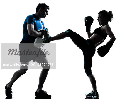 one caucasian couple man woman personal trainer coach man woman boxing training silhouette studio isolated on white background