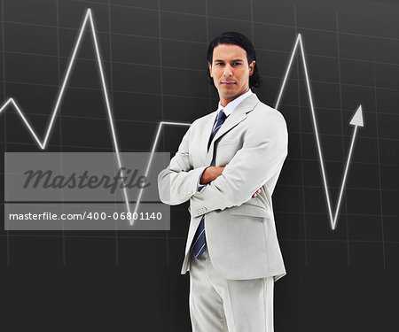 Businessman with arms crossed standing in front of a statistic