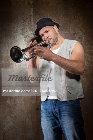 Portrait of Musician Playing Trumpet, Studio Shot
