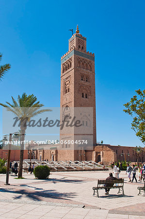 Moroccan man sat on a bench in front of Koutoubia Mosque, Marrakech, Morocco, North Africa, Africa Moroccan man sat on a bench in front of Koutoubia Mosque, Marrakech, Morocco, North Africa, Africa