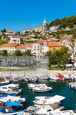 Hvar harbour and church bell tower in Hvar town centre, Hvar Island, Dalmatian Coast, Adriatic, Croatia, Europe