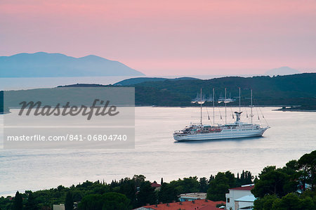 Mediterranean cruise ship at sunset, Hvar Town, Hvar Island, Dalmatian Coast, Adriatic, Croatia, Europe Mediterranean cruise ship at sunset, Hvar Town, Hvar Island, Dalmatian Coast, Adriatic, Croatia, Europe