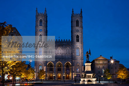 The Notre Dame Cathedral at dusk in the Place d'Arms, Montreal, Quebec Province, Canada, North America