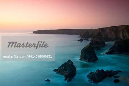 A view of the Bedruthan Steps at dusk, Cornwall, England, United Kingdom, Europe A view of the Bedruthan Steps at dusk, Cornwall, England, United Kingdom, Europe