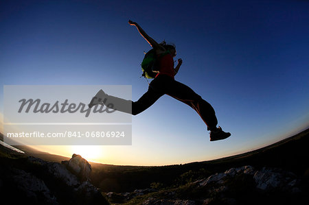 A woman runs in the Mendip Hills, Somerset, England, United Kingdom, Europe