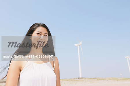 Woman in a white dress on the beach