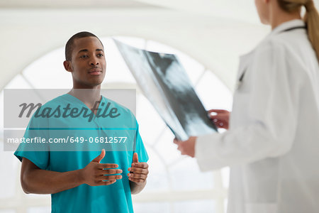 Two doctors looking at xray