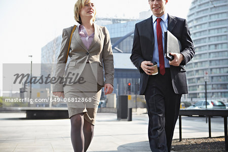 Two businesspeople walking in city