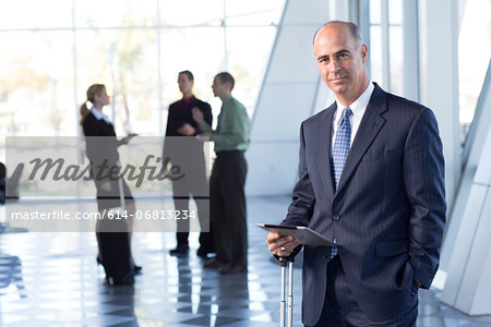 Mature businessman with digital table