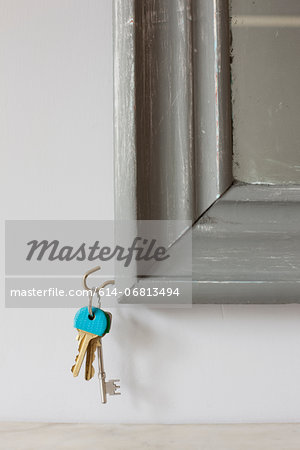 House keys on hook on mirror