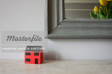 Model of house on mantelpiece