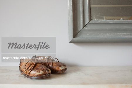 Brown leather shoes on mantelpiece