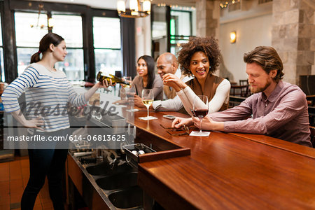 Customers drinking at bar