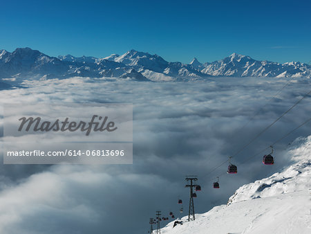 Ski lifts in ski resort with low cloud