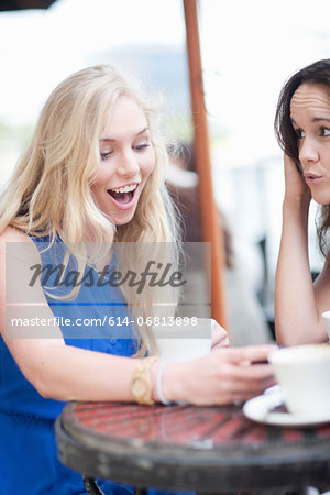 Young women chatting at cafe