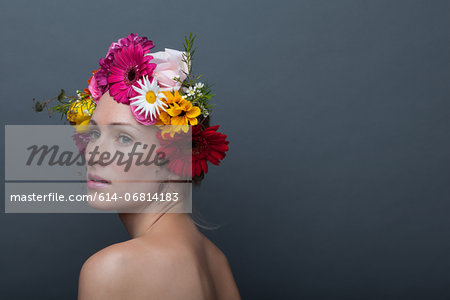 Young woman wearing garland of flowers on head