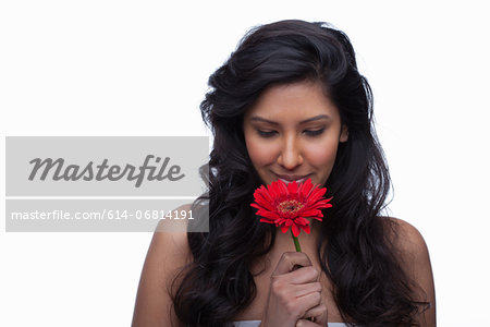 Young woman with red flower