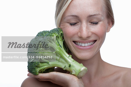 Young woman with broccoli