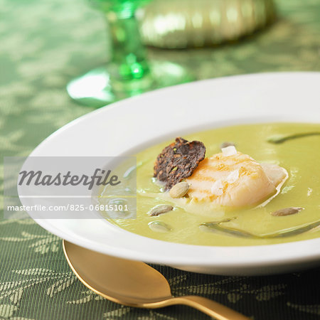 Cream of pea soup with scallops