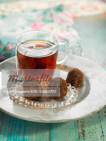 Oatmeal,fenugreek and carouba flour truffles with a cup of tea