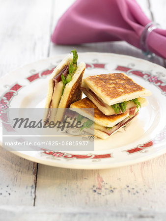 Raw ham,asparagus and melted cheese toasted sandwiches