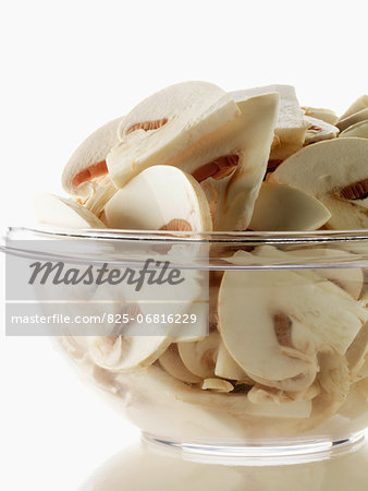 Raw sliced button mushrooms