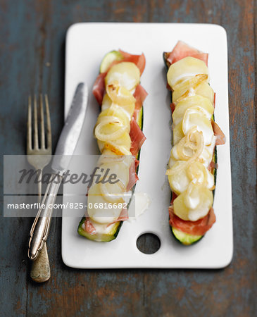 Zucchinis with raw ham ,potatoes,onions and cream