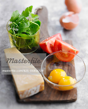 Parmesan,egg yolks,tomatoes and rocket lettuce