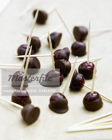 Cherries coated in chocolate on sticks