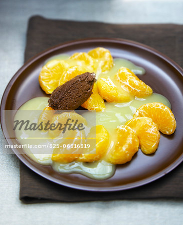 Clementine segments with sauce and chocolate quenelle