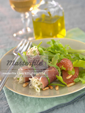 Raw ham rolls stuffed with sauerkraut ,grapefruit and lettuce salad