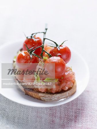 Crushed tomatoes,celery and cherry tomatoes on toast