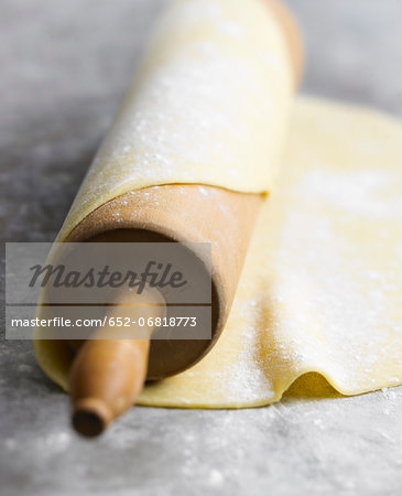 Spreading the pastry dough with a rolling pin