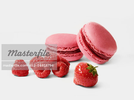 Macaroons and fresh raspberries and strawberry Macaroons and fresh raspberries and strawberry