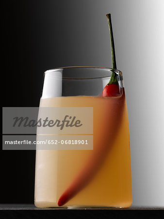 Vodka,orange and red hot pepper cocktail