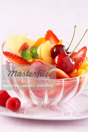 Fresh fruit salad with raspberry syrup
