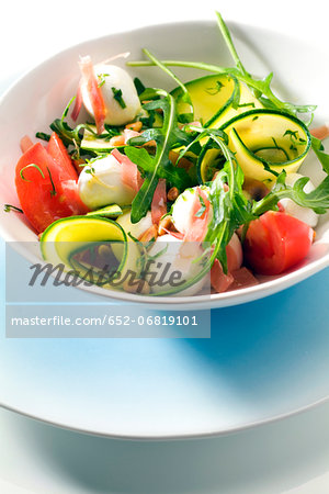 Rocket lettuce,zucchini,mozzarella,tomato and raw ham salad Rocket lettuce,zucchini,mozzarella,tomato and raw ham salad