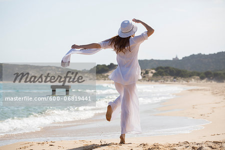Woman Walking on Beach, Sardinia, Italy