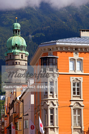 Austria, Tyrol, Innsbruck. Tower ancd part of a facade in the historical centre