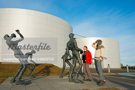 Iceland, Reykjavik, Perlan - The Pearl, tourists looking at statues (MR)