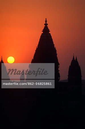 Asia, India, Madhya Pradesh, Orchha.  Sunset over the skyline of Orchha showing the spires of Chaturbhuj temple.