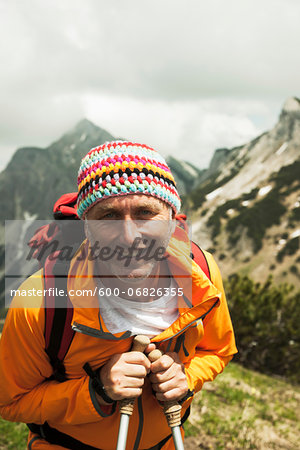 Close-up portrait of mature man hiking in mountains, Tannheim Valley, Austria