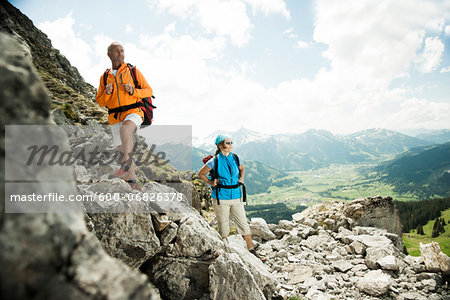 Mature couple hiking in mountains, Tannheim Valley, Austria