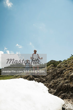 Mature couple hiking in mountains, Tannheim Valley, Austria