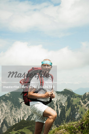 Portrait of mature man hiking in mountains, Tannheim Valley, Austria