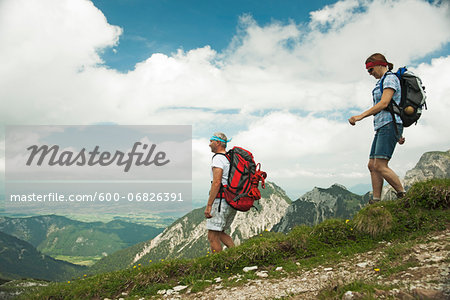 Mature couple hiking in mountains, Tannheim Valley, Austria