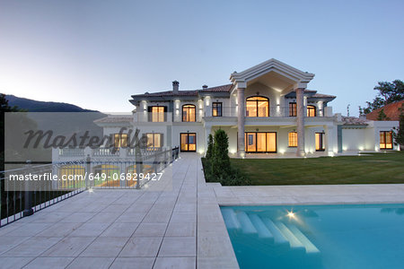Swimming pool of luxury villa at dusk Swimming pool of luxury villa at dusk