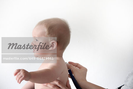 Baby boy having medical examination
