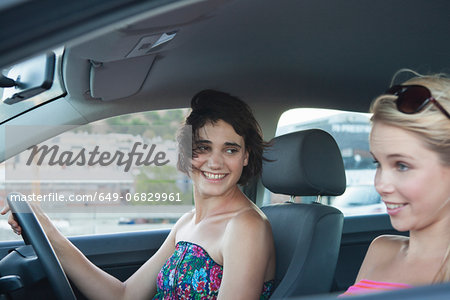Two women driving car